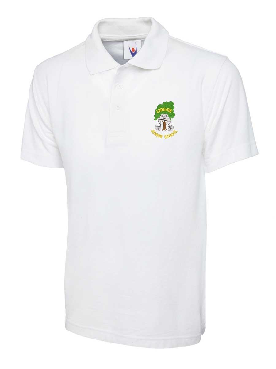 White polo shirt featuring a collar and short sleeves. There is a small embroidered logo on the left chest, depicting a figure with a sword and text around it. The shirt is displayed against a plain white background.