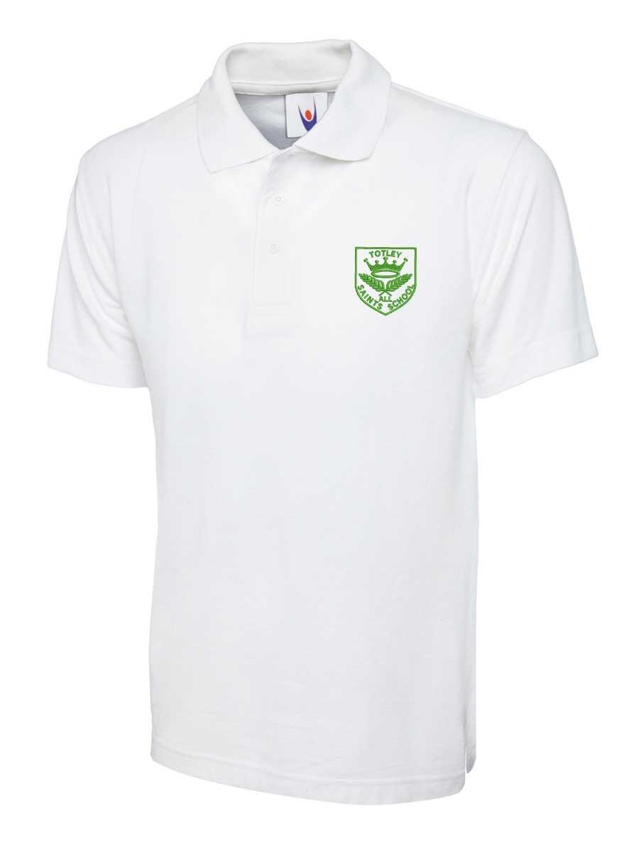 White polo shirt featuring a green embroidered emblem on the left chest area. The emblem has text and a graphic. The shirt has short sleeves and a buttoned collar.